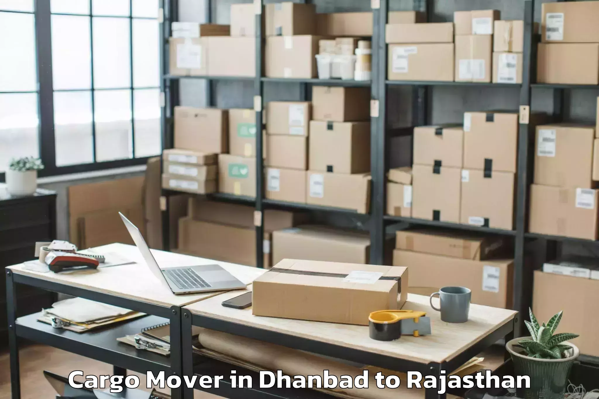 Easy Dhanbad to Madanganj Kishangarh Cargo Mover Booking